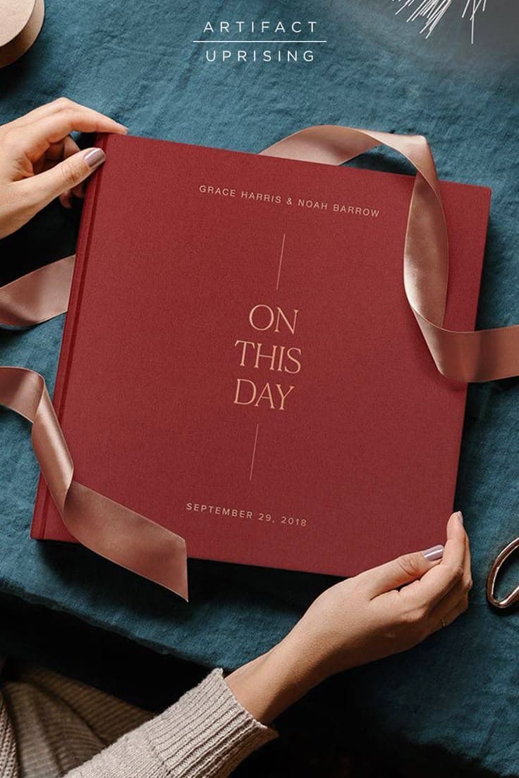 Hardcover photobook wrapped as a gift with ribbon